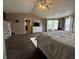 Large main bedroom with ceiling fan, multiple windows, and ensuite bathroom at 5502 Floating Leaf Dr, Indianapolis, IN 46237