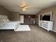 Spacious main bedroom with a ceiling fan, white trim and neutral colored walls at 5502 Floating Leaf Dr, Indianapolis, IN 46237