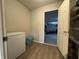 Storage room with wood flooring, a freezer and shelves for storage at 5502 Floating Leaf Dr, Indianapolis, IN 46237