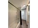 Bathroom featuring shower over tub, tile surround, and window at 5760 Tim Tam Ct, Indianapolis, IN 46237