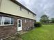 Exterior of property with brick and vinyl siding and large backyard at 5760 Tim Tam Ct, Indianapolis, IN 46237