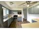 Functional kitchen with stainless steel appliances, updated cabinetry, and ample counter space at 5760 Tim Tam Ct, Indianapolis, IN 46237
