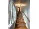 Wooden staircase with white railings leading to the upper level of the home at 5760 Tim Tam Ct, Indianapolis, IN 46237