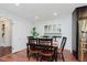 Dining room adjacent to kitchen with hardwood flooring and modern style at 6030 Riverview Dr, Indianapolis, IN 46208