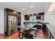 Gourmet eat in kitchen with stainless appliances, granite countertops, and island at 6030 Riverview Dr, Indianapolis, IN 46208