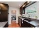 Updated kitchen featuring stainless appliances, granite countertops, and window over sink at 6030 Riverview Dr, Indianapolis, IN 46208