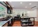 Gourmet eat in kitchen with stainless appliances, granite countertops, eat in island, and gas cooktop at 6030 Riverview Dr, Indianapolis, IN 46208