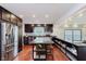Gourmet eat in kitchen with stainless appliances, granite countertops, and eat in island at 6030 Riverview Dr, Indianapolis, IN 46208