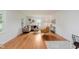 Cozy living room with hardwood floors, white walls, and large windows at 6030 Riverview Dr, Indianapolis, IN 46208