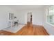 Bright office space with hardwood flooring, natural light, and an adjacent room at 6030 Riverview Dr, Indianapolis, IN 46208