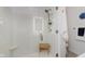 This bright shower showcases elegant white tiling and gold fixtures, creating a luxurious feel at 6030 Riverview Dr, Indianapolis, IN 46208