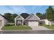 Charming single Gathering home with brick and gray siding and well-maintained landscaping at 611 Bridgeman Rd, Avon, IN 46123