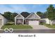 Charming single-story home with brick accents, a manicured lawn, and an attached two-car garage at 611 Bridgeman Rd, Avon, IN 46123