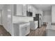 Bright kitchen featuring white cabinets, gray countertops, and stainless steel appliances at 611 Bridgeman Rd, Avon, IN 46123
