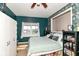 Comfortable bedroom with natural light, closet storage, and dark accent wall at 635 E 10Th St, Indianapolis, IN 46202