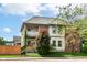Charming two-story home with a fenced yard and inviting front porch at 635 E 10Th St, Indianapolis, IN 46202