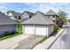 Spacious two-car garage with a concrete driveway and a well-manicured lawn at 635 E 10Th St, Indianapolis, IN 46202