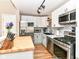 Modern kitchen featuring stainless steel appliances and bright lighting at 635 E 10Th St, Indianapolis, IN 46202