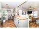Open kitchen with island, stainless steel appliances, and seamlessly connected living area at 635 E 10Th St, Indianapolis, IN 46202
