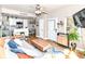 Bright living room open to kitchen featuring wood floors and natural light at 635 E 10Th St, Indianapolis, IN 46202