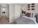 Well-lit bedroom with decorative footballs and a cozy, inviting atmosphere at 6574 Halsey St, Zionsville, IN 46077