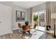 Cozy dining area with a glass table, stylish chairs, and a sliding door leading to an outdoor area at 6574 Halsey St, Zionsville, IN 46077