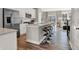 A modern kitchen with stainless steel appliances, a large island, and bar stool seating at 6574 Halsey St, Zionsville, IN 46077