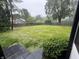Large backyard features a lush lawn, mature trees, and a wood fence at 6609 N Tuxedo Ln, Indianapolis, IN 46220