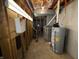 Utility area featuring water heater, furnace and other essential equipment, neatly organized in the basement at 6609 N Tuxedo Ln, Indianapolis, IN 46220