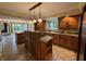 Gourmet kitchen featuring custom wood cabinets, tiled floors, and large island at 6609 N Tuxedo Ln, Indianapolis, IN 46220