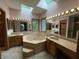 Luxurious main bathroom with soaking tub, dual sinks, and vanity with a skylight at 6609 N Tuxedo Ln, Indianapolis, IN 46220
