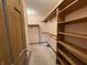 Walk-in closet with built-in shelving and ample storage space at 6609 N Tuxedo Ln, Indianapolis, IN 46220