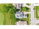 Birds eye view of home's backyard showing a large roof, lawn and the street nearby at 6610 Royal Oakland Dr, Indianapolis, IN 46236