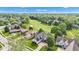 A golf course community contains single-Gathering homes, green space and trees at 6610 Royal Oakland Dr, Indianapolis, IN 46236