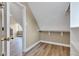 Bright attic storage area with hardwood floors and built-in shelving at 6610 Royal Oakland Dr, Indianapolis, IN 46236