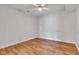 Bedroom with light-colored walls, wood floors, and a ceiling fan installed at 6610 Royal Oakland Dr, Indianapolis, IN 46236