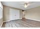 Bedroom featuring closet and laminate flooring at 6610 Royal Oakland Dr, Indianapolis, IN 46236
