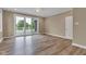 Spacious bedroom with wood floors, a sliding glass door, and lots of natural light at 6610 Royal Oakland Dr, Indianapolis, IN 46236