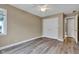 Bedroom features light brown walls, ceiling fan, and laminate flooring at 6610 Royal Oakland Dr, Indianapolis, IN 46236