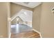 The bonus room includes wood-look floors and vaulted ceilings at 6610 Royal Oakland Dr, Indianapolis, IN 46236
