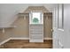 Walk-in closet features shelving and a window for natural light at 6610 Royal Oakland Dr, Indianapolis, IN 46236