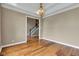 Bright dining area with hardwood floors, elegant lighting, and an open view of the staircase at 6610 Royal Oakland Dr, Indianapolis, IN 46236