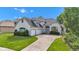 A single Gathering home features a painted brick exterior, arched windows, and manicured lawn at 6610 Royal Oakland Dr, Indianapolis, IN 46236