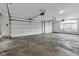 Attached three car garage with concrete flooring at 6610 Royal Oakland Dr, Indianapolis, IN 46236