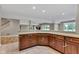 Basement kitchen featuring a bar with countertop and wood cabinets at 6610 Royal Oakland Dr, Indianapolis, IN 46236