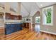 Kitchen with vaulted ceilings and eat-in area at 6610 Royal Oakland Dr, Indianapolis, IN 46236