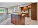 Basement kitchen featuring a bar with countertop and wood cabinets at 6610 Royal Oakland Dr, Indianapolis, IN 46236
