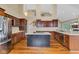 Spacious kitchen with wood floors, stainless steel appliances, and center island at 6610 Royal Oakland Dr, Indianapolis, IN 46236