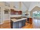 Bright kitchen with stainless steel appliances, island and wooden cabinetry at 6610 Royal Oakland Dr, Indianapolis, IN 46236