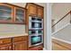 Wall oven with wood cabinets in this modern, bright kitchen at 6610 Royal Oakland Dr, Indianapolis, IN 46236